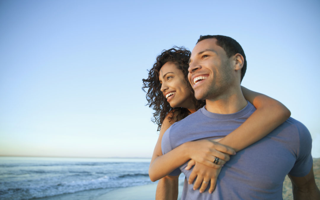 Couple smiling on beach